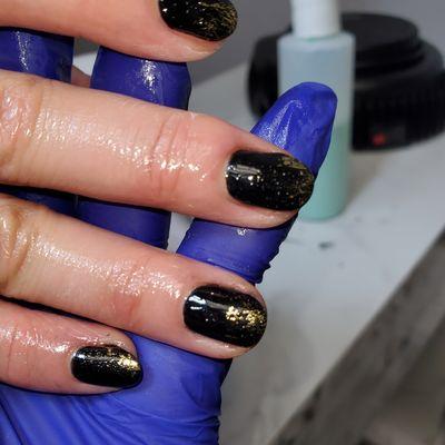 Black gel with some gold loose flakes simple chic and clean