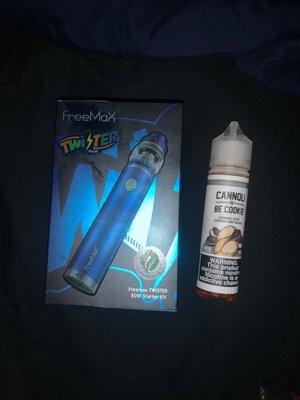 Freemax Twister 80W Starter kit and Cannoli Be Cookie 6mg 60mL vaping juice.