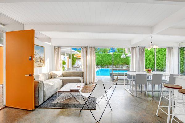 A south facing wall of windows faces the pool in Unit 5 at The Amado