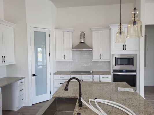 Kitchen, cabinets and interior glass door