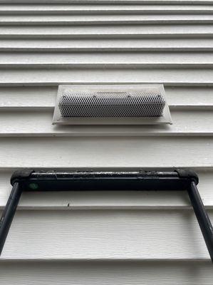 The exhaust vent for our microwave -- after installing a custom cover