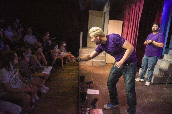 Rockin' Awesome Improv Show cast member, Jeremy, asking for audience suggestions!