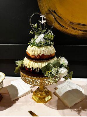 Bundt cakes with added flowers from our decor specialist.  Topper was parents wedding cake (35 years ago)