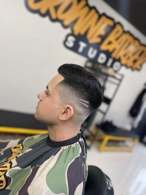 High skin fade with a light design!