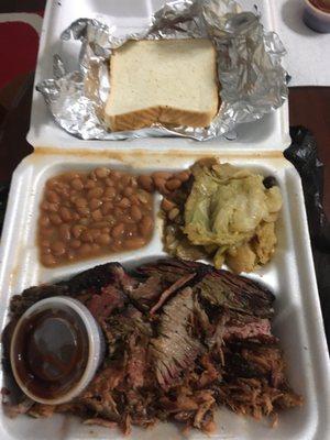 Meat combo plate with brisket, pulled pork, beans, and roasted cabbage