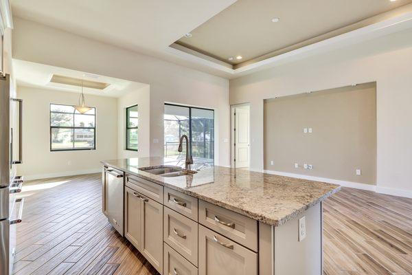 White Cabinets, light coutertops and wood plank tiles