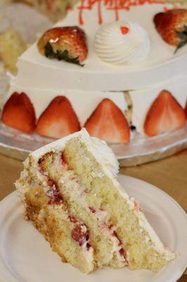 Slice of Fraisier cake - vanilla cake, pastry cream, buttercream, strawberries, strawberry liquor