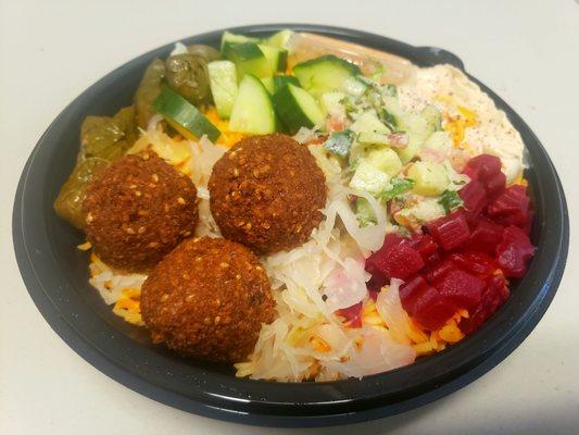 Build your own mediterranean bowl with half falafel, half dolma (via doordash).