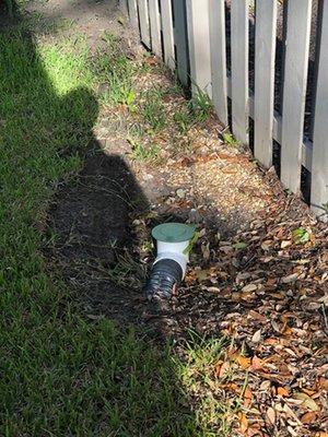 This drain was supposed to empty just outside the fence in the photo.  Close but no cigar.