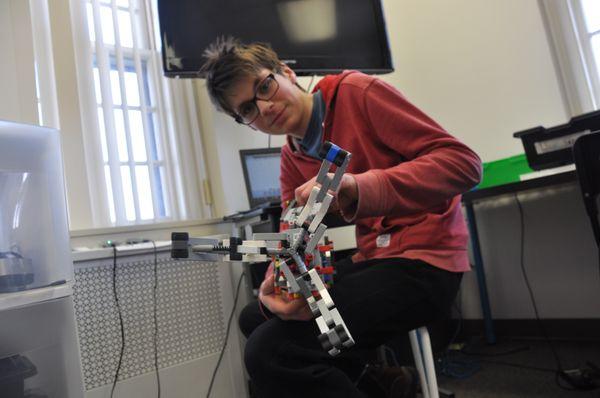 Empow Studios student shows off his custom robotics arm built and programmed using LEGO EV3 MINDSTORMS