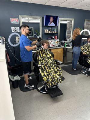 Little man is getting all cleaned up in the best barbershop in Clear Lake!