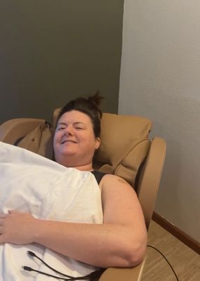 Holly Brink relaxing in Zero Gravity massage chair while getting her drip on a Sunday afternoon.