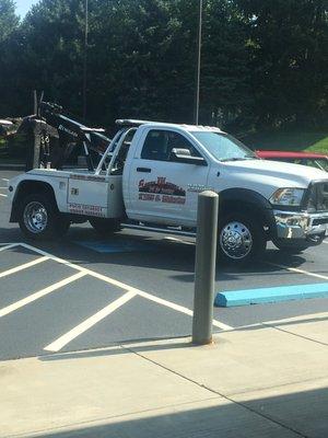 The driver seemed to have difficulty operating his vehicle so he parked diagonally across a handicap spot and a regular spot