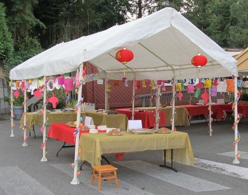 Moon (Harvest) Festival celebration tent for students and their families - harvest craft-making,  moon cakes, displays