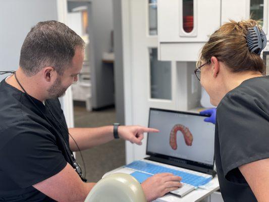 Dr. Hrencher in discussion with dental hygienist at Hrencher Dental