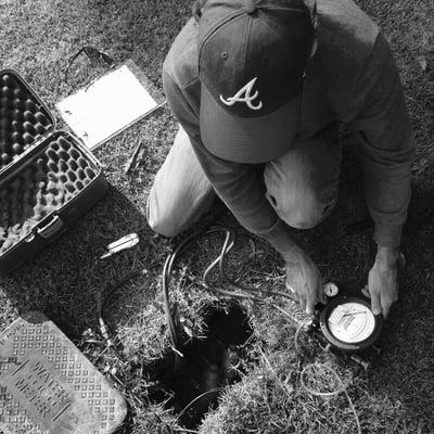 Owner Jason Irvin performing a backflow test.