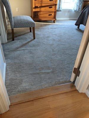 Master Bedroom buckling carpet