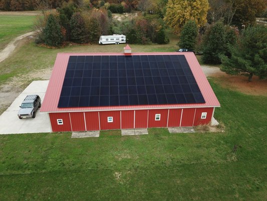 Agricultural barn roof mount solar array SunPower all black panels