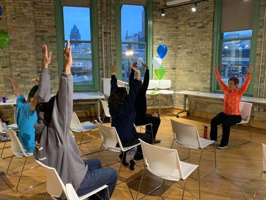 Leading Chair Yoga at Rockwell Automation's 24-to-Code event in December 2019.