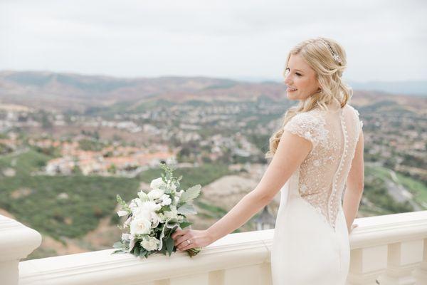 Felicity delicately repaired pearl beading on the back of my dress. Photo by Jennifer of Gilmore Studios in Costa Mesa.