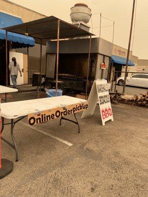 Online order pick up spot and the massive grill