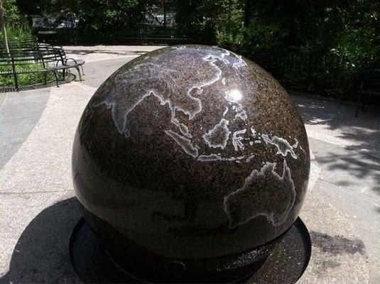 Globe of world that spins on water.