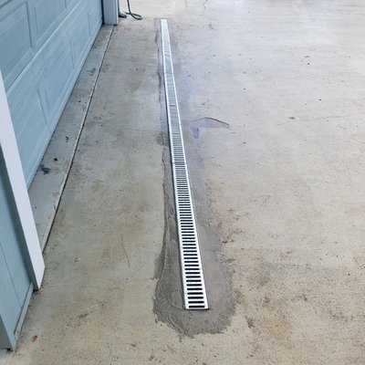 Install drain to stop water from entering the garage