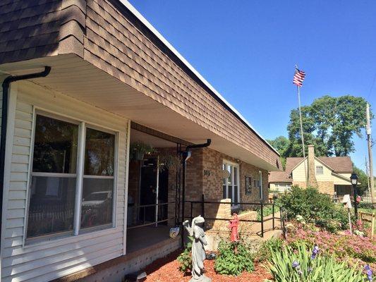 Small Garden and U.S. Flag near the Entrance - Country Care Nursing Home