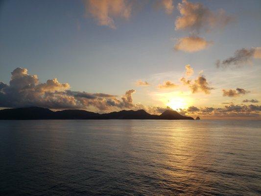 Sailing past Martinique at sunrise. Nov 2019. Have you looked at cruising lately? Contact Nicks Easy Travel!