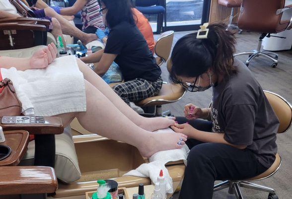 Wife getting her pedicure.