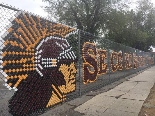 Second Street Trojan Pride! Chain Link Fence Beautification Grant Award!  Families volunteered to install the design one tile at a time.