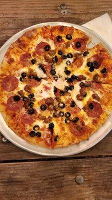 Meat pizza with olives