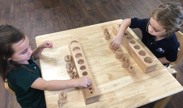 Students working together with the Knobbed Cylinders.