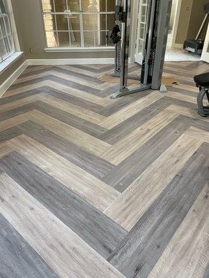 Apartment complex gym. Herringbone style. Beautiful combination