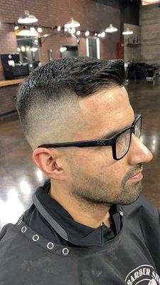 High bald fade comb over scissor trim on top