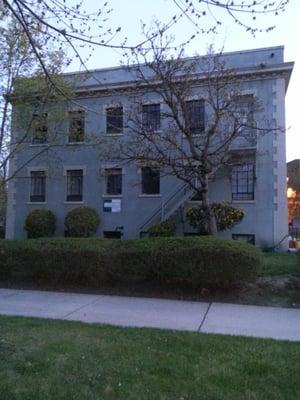 green and white office building on the corner