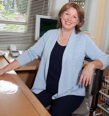 Dr. Brigitte at her desk.