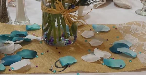 Rustic Blue Wedding place mat, petals, and jewels.