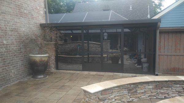 Custom screened-in outdoor room built by Bayou Aluminum Enclosures