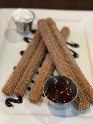 Churros with whip cream and chocolate sauce. So good.