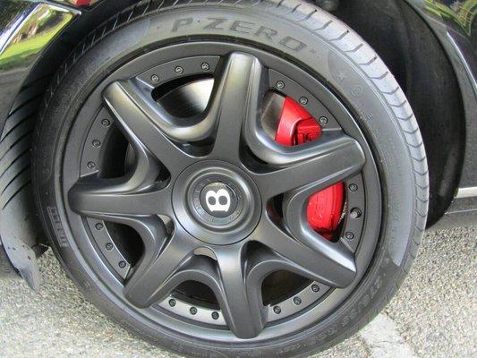 Flat black rims with bright red calipers.Customer dropped off the car we did the rest.