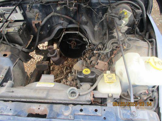 Underhood of my jeepa picture which was sent when they stated to Att Gen Con Prot Div / that they had my car & fixed it 11 months no engine