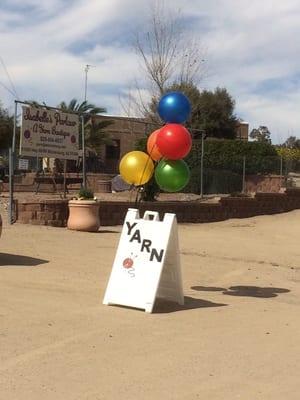 Sandwich board sign and balloons always out to catch your eye!