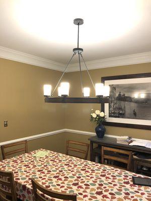 Installed chandelier in dining room