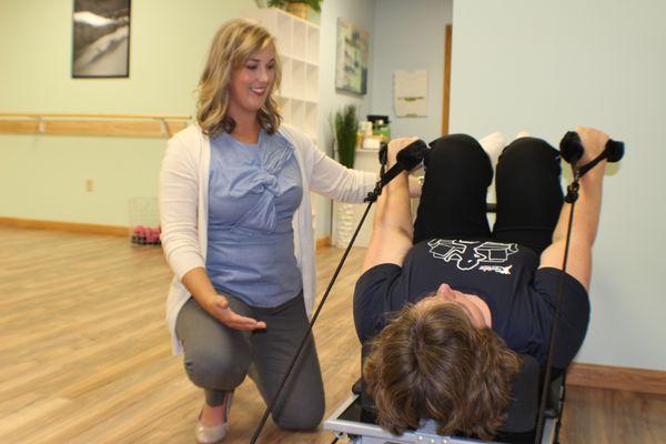 Providing hands-on, personalized care with the pilates reformer for core strengthening to alleviate incontinence and back pain.