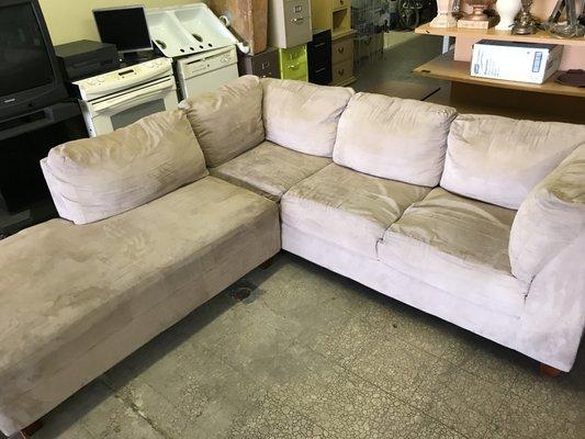 Beige colored two piece sectional priced to sell $200.00 ( Used)