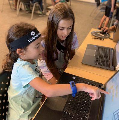 Girls and Boys ages 7 to 14 enjoy building games and learning to code.