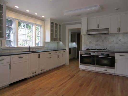 Traditional style kitchen with soapstone counters and marble backsplashes