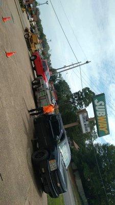 Two of our 5 trucks and a dump trailer and stumper grinder