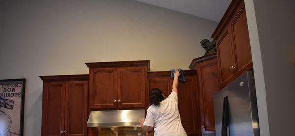 We reach high to clean all your cabinets.